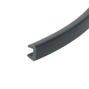 Close-up of a dark metal channel with a rounded inner edge, diagonally oriented across the image.