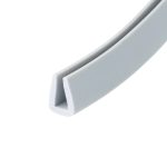 Close-up of a light gray plastic channel with a U-shaped profile photographed at an angle.