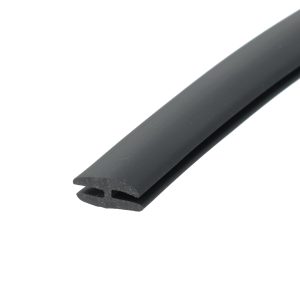 Close-up of a black rubber weatherstripping extrusion with a U-shaped channel cross-section.