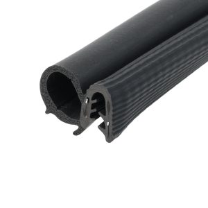 Close-up of a black foam rubber tube with a round hollow center and ribbed exterior profile, likely a seal or insulation tubing.