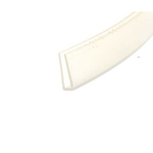 Close-up of a pale binder or notebook edge with evenly spaced holes along the spine, seen at a diagonal angle