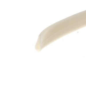 Close-up of a white curved dish edge against a white background with soft shadows.