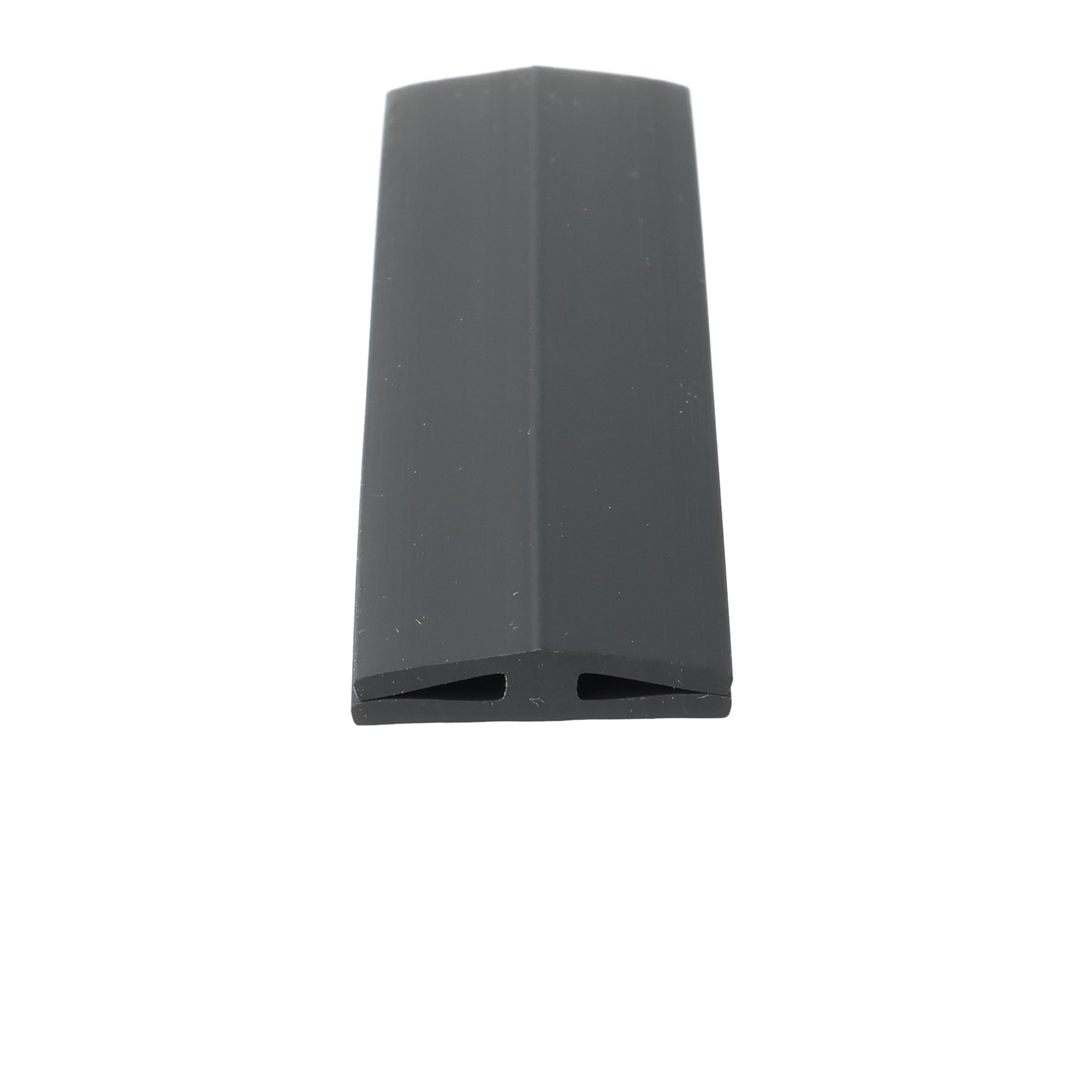 uszczelka-krawedziowa-szyby-plyty-poliweglanowej-typ-h-miekkie-pvc-h-1-2-x-5-x-24-mm-czarna-12-841-3 - Centrum uszczelek Close-up of a black plastic object with a rounded top and two rectangular slots at the bottom against a white background.