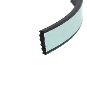 Close-up of a curved teal foam strip with a black outer edge.