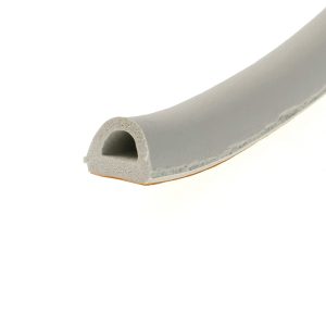 Cross-section of a light-gray foam extrusion showing a circular hollow channel inside, viewed at an angle