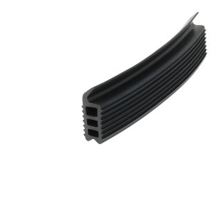Close-up of a black, ribbed rubber weather seal with rectangular hollow channels, typical for doors/windows.