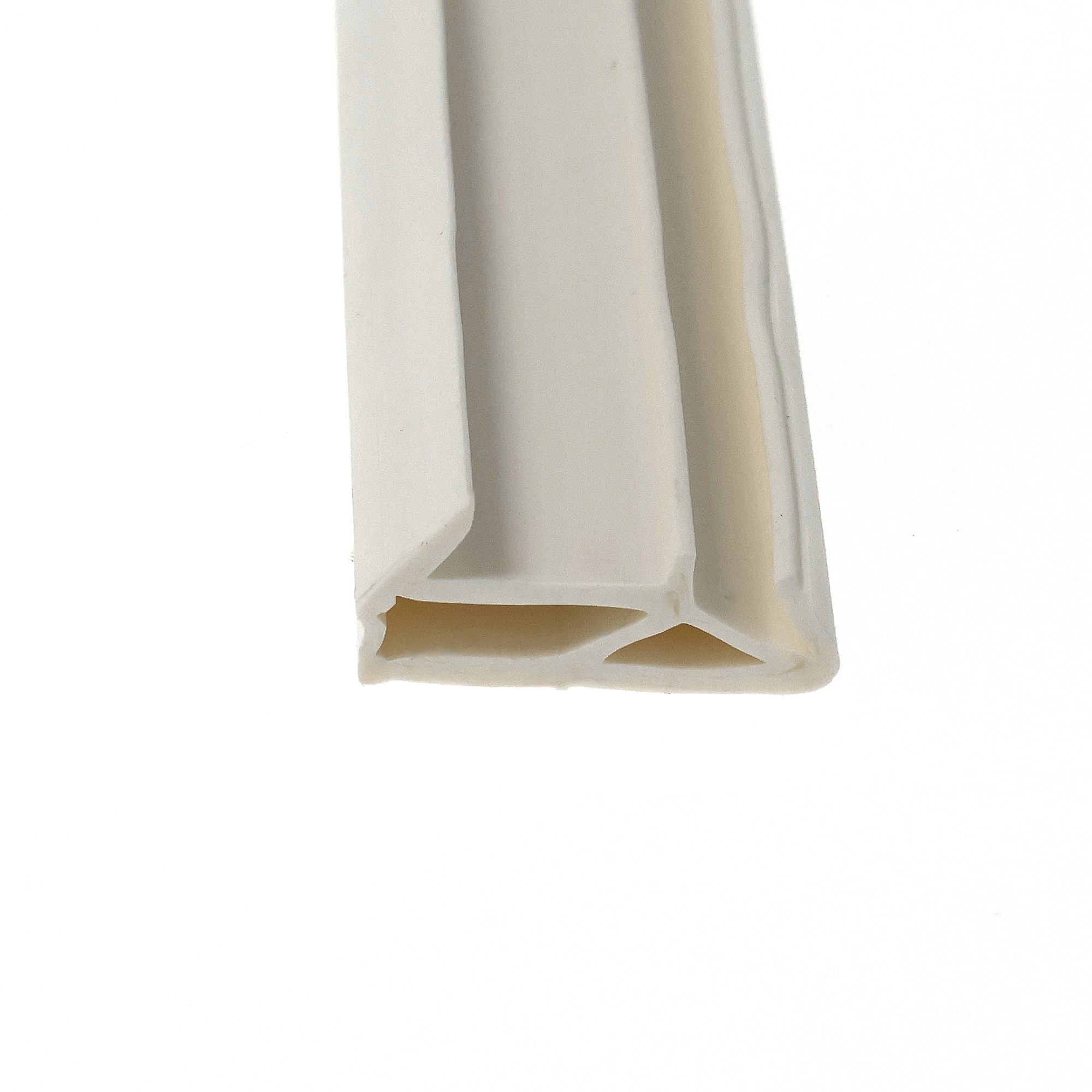 uszczelka-przylgowa-okna-drewnianego-tpe-biala-09-768-3 - Centrum uszczelek Close-up of a curved beige and white plastic edge with layered, rounded surfaces.