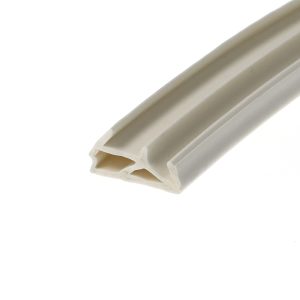 Close-up of a white plastic extrusion with a hollow channel, diagonally oriented.
