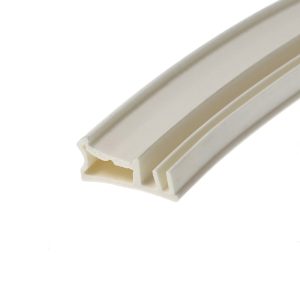 Close-up of white plastic trim with hollow channel, photographed at an angle on a white background.