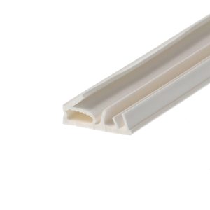 Close-up of white plastic corner trim (PVC) with ribbed channel profile, photographed at an angle.