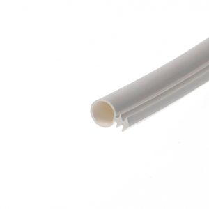 Close-up of two white PVC tubes with circular ends lying diagonally in the bottom-right corner.