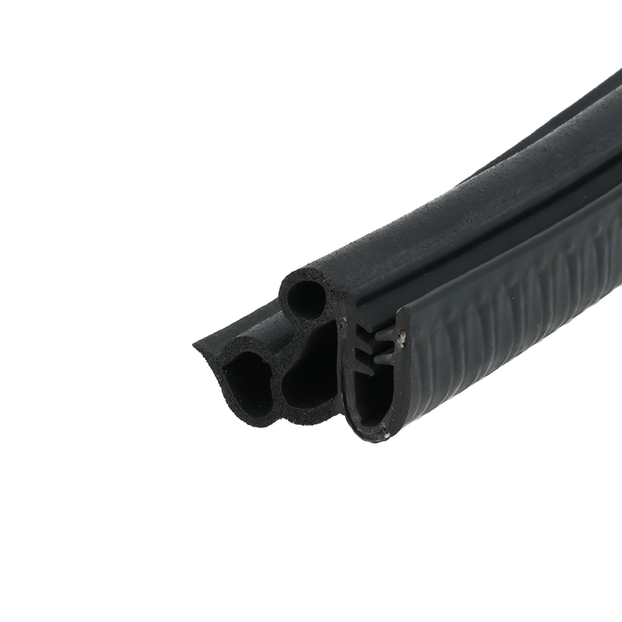 uszczelka-samochodowa-zaciskowa-na-krawedz-5-6mm-12-113-3 - Centrum uszczelek Close-up of a black textured firearm handguard with circular ports and ribbed surface.