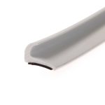 Close-up of a white plastic object with a rounded edge and a small red detail on a white background.