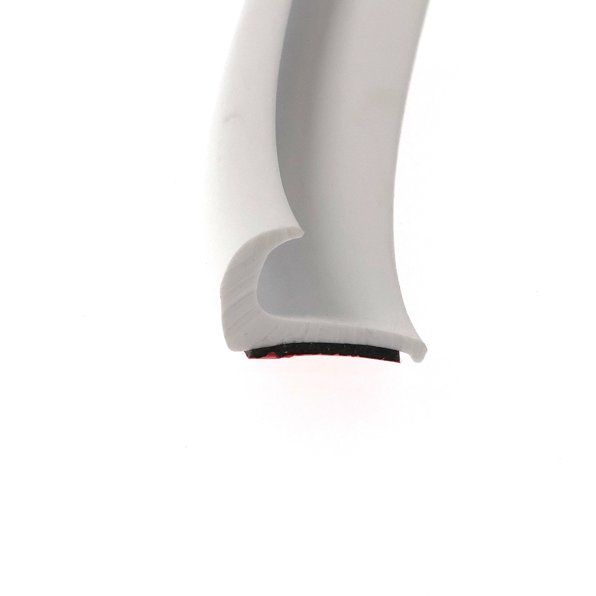 uszczelka-samoprzylepna-3m-okapnik-gumowa-13-x-23mm-biala-07999-5 - Centrum uszczelek Close-up of a white curved plastic object with a dark base and a small red detail at the bottom.