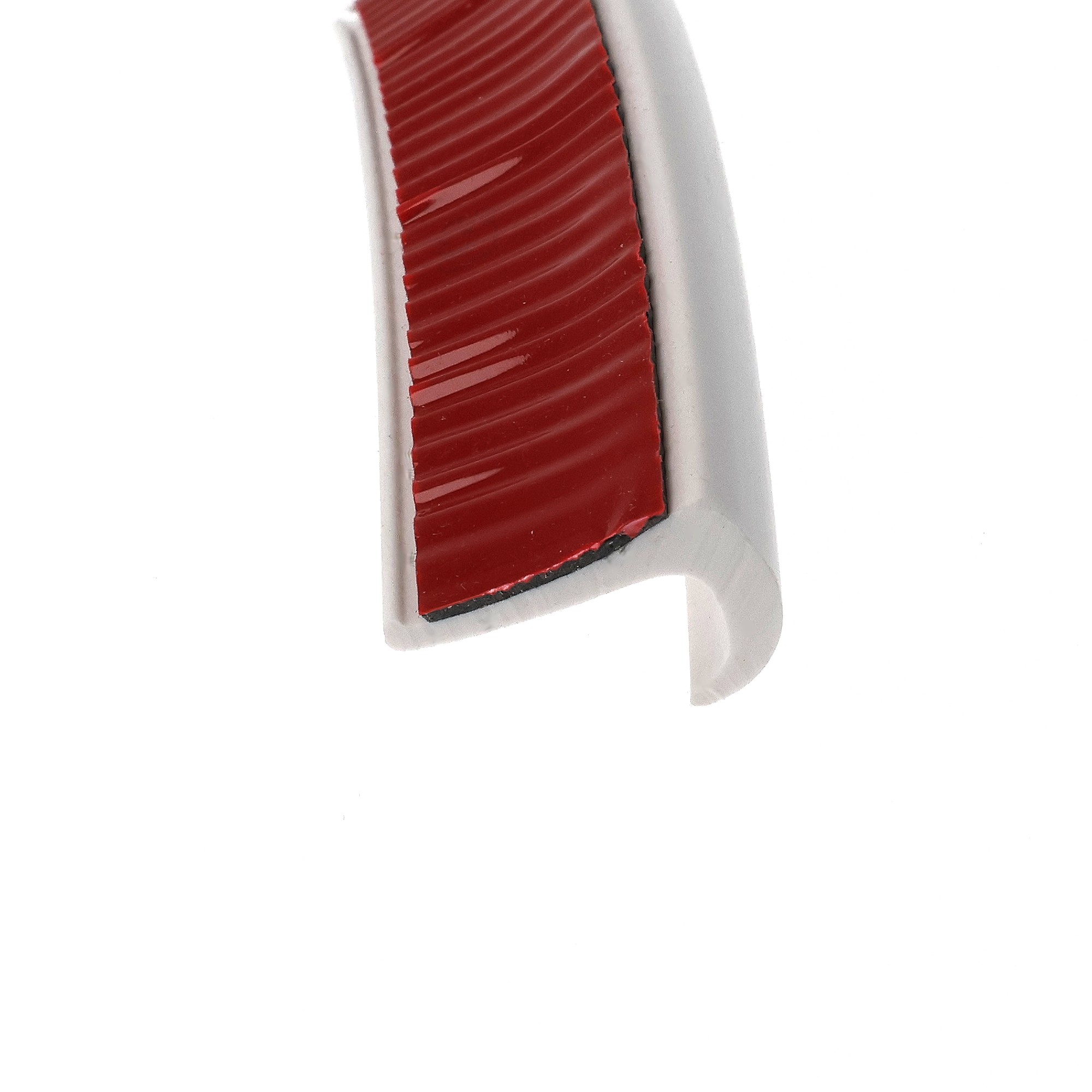 uszczelka-samoprzylepna-3m-okapnik-gumowa-13-x-23mm-biala-07999-6 - Centrum uszczelek Close-up of a red grooved grip set inside a curved gray plastic handle, viewed at an angle.