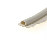 Close-up of a white rolled sheet or tubing with hollow cylindrical cores resting on a white surface.