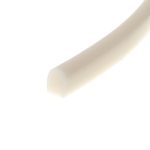 Close-up of a beige curved plastic object extending diagonally across a white background.
