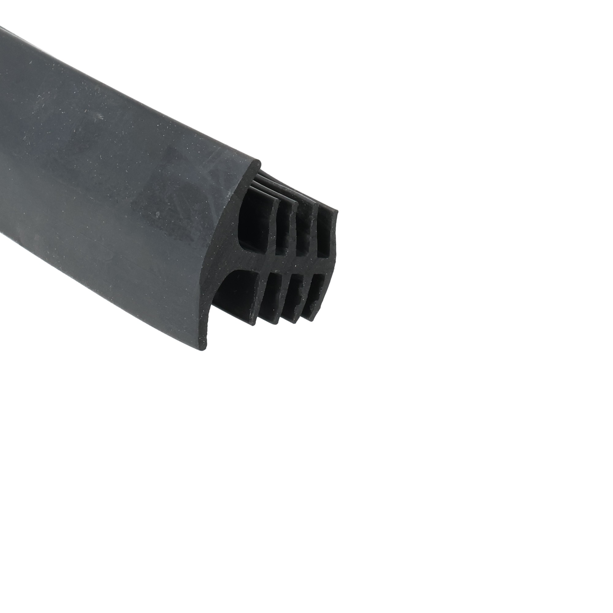 uszczelka-szczelinowa-gumowa-typ-t-18-x-23-x-28mm-czarna-68-8011-1 1 - Centrum uszczelek Close-up of a black plastic tool or connector with ribbed vent-like slots along a curved edge, set against a white background.