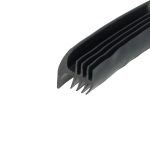 Close-up of a black plastic object with several parallel teeth, like a comb, diagonally placed against a white background.