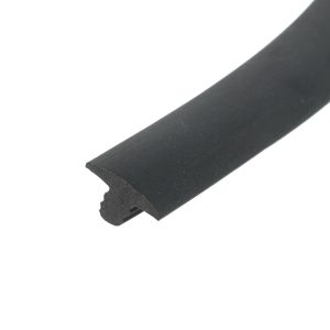 Close-up of a black diagonal strip with a chipped, rough end on a white background