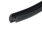 Close-up of a black curved plastic rail with a U-shaped groove and rounded edge.