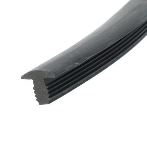 Close-up of a black rubber extrusion with multiple ridges and a curved tapered end.
