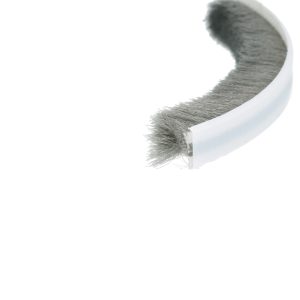 Close-up of a circular hairbrush with dense gray bristles against a white background.