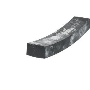 Close-up of a curved dark metal beam with a weathered, dusty surface against a white background.
