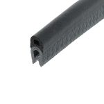 Close-up of a black, textured cylindrical grip with a hollow core, like a bike or tool handle