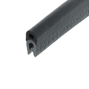 Close-up of a black, textured cylindrical grip with a hollow core, like a bike or tool handle