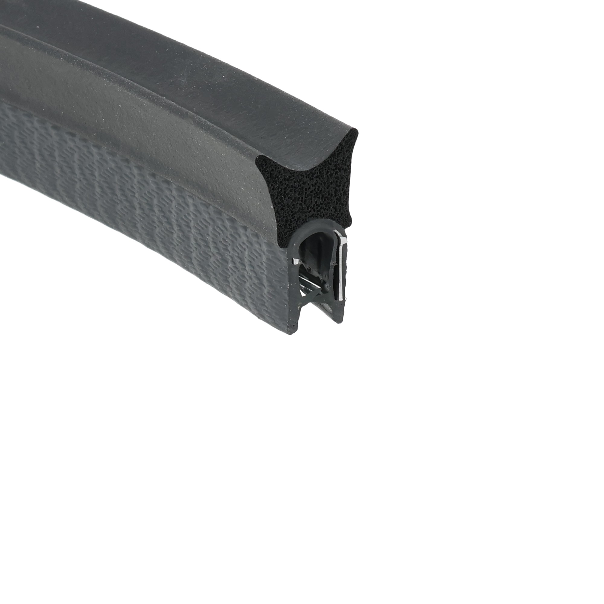 uszczelka-zaciskowa-oslona-krawedzi-1-4mm-epdm-08-121-1 - Centrum uszczelek Close-up of a black textured plastic grip with a curved edge and a hollow end, showing a small mounting cavity beneath the surface.