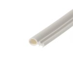 Close-up of white paper rolls or poster tubes lying diagonally across a white surface.