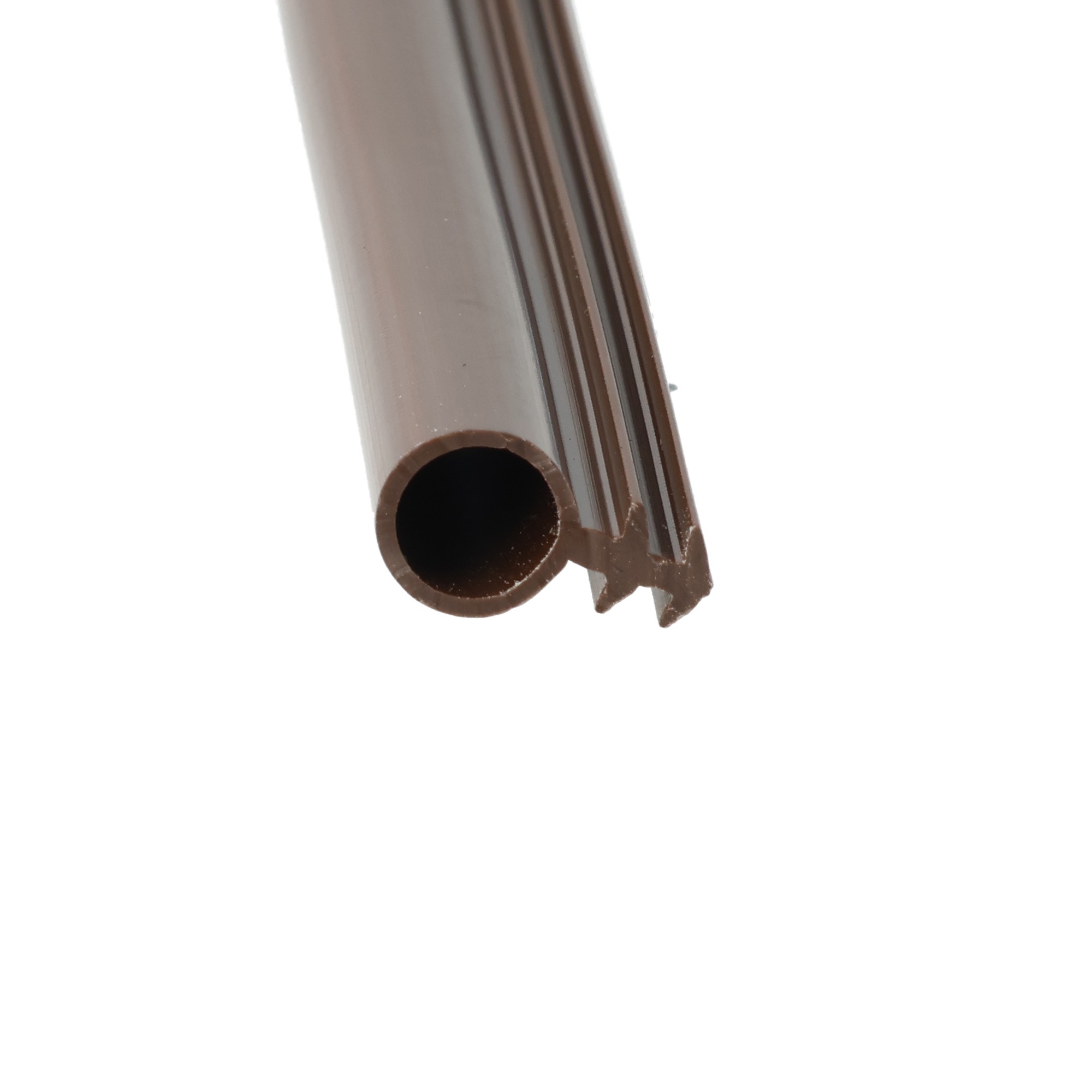 Uszczelka renowacyjna do okien i drzwi fi 8mm brązowa 12-11165-1 3 - Centrum uszczelek Close-up of a brown plastic cylindrical pipe with an open end, angled diagonally across the frame.
