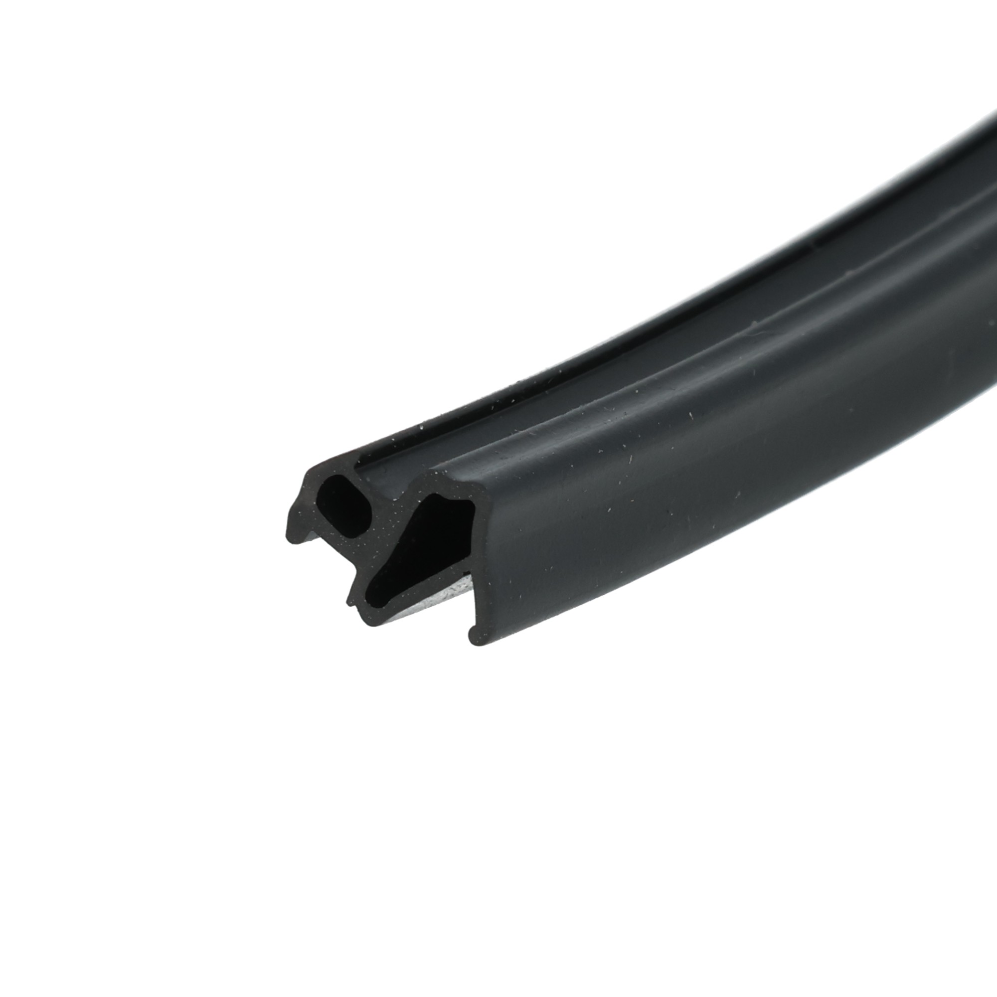 uszczelka-do-okien-pcv-s-1172-04-172-4 - Centrum uszczelek Close-up of a black metal rail with rounded cutouts, photographed at an angle against a white background.