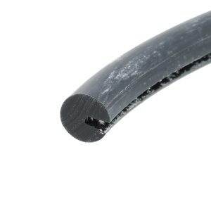 Close-up of a weathered black rubber hose bent diagonally against a white background, with white specks on its surface.