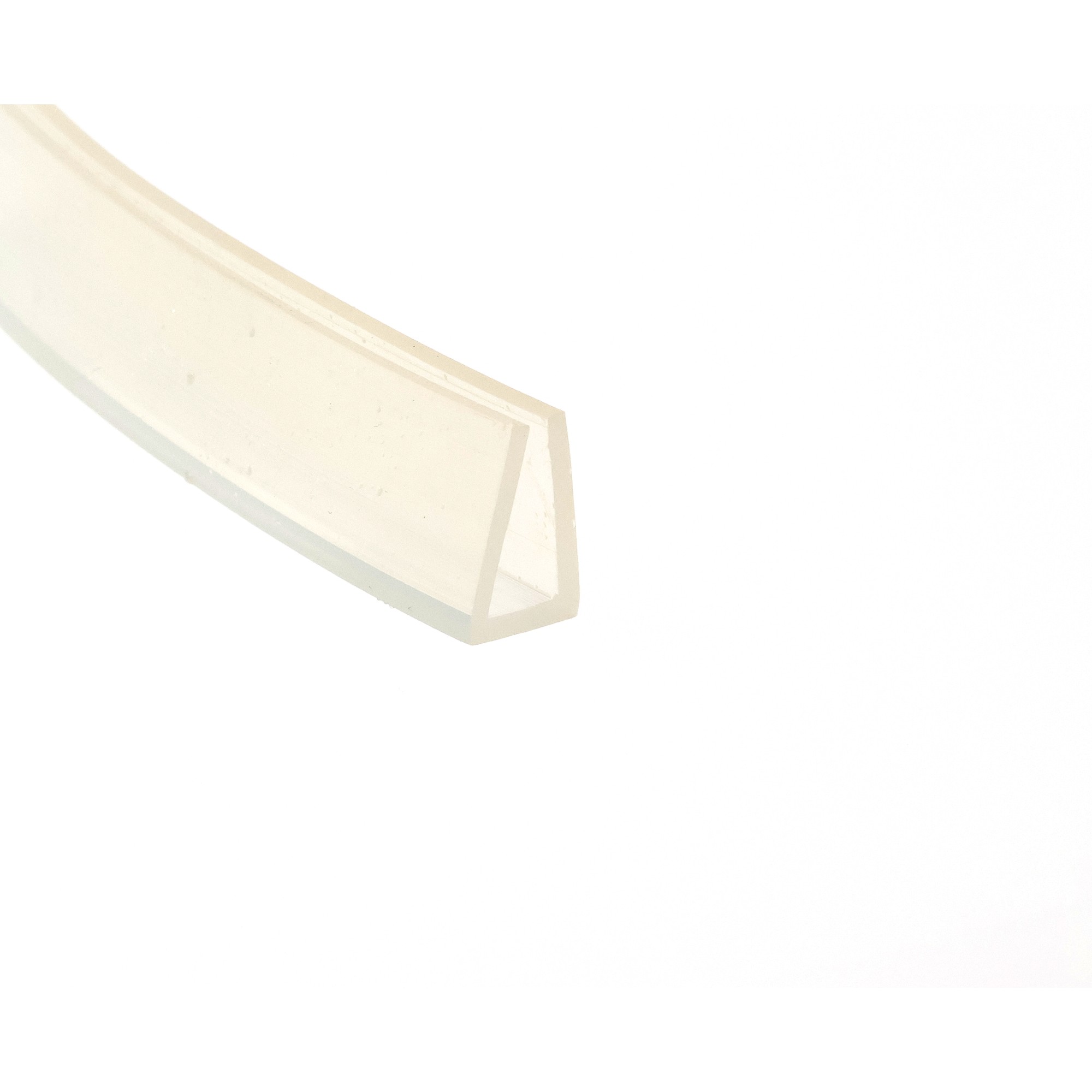 uszczelka-krawedziowa-silikonowa-8-x-12-x-18mm-bezbarwna-023891-1 1 - Centrum uszczelek Close-up of a pale, angled translucent edge (glass/plastic) against a white background, abstract composition.