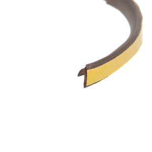 Close-up of a yellow leather belt curved through the frame, showing brown inner side and belt tip.