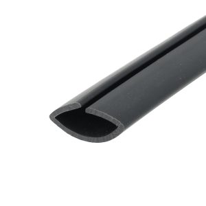 Close-up of a black plastic rail or channel with a rounded rectangular opening, diagonally placed against a white background.