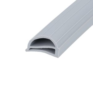 Close-up of a light gray plastic gutter with a curved, hollow cross-section and ribbed edges diagonal across the image.