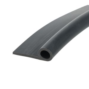 Close-up of a dark cylindrical rod with a hollow circular end, angled across a white background, suggesting a metal pin or tube piece