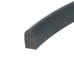 Close-up of a black cylindrical pipe lying diagonally across a white background, showing its rounded end and surface texture.