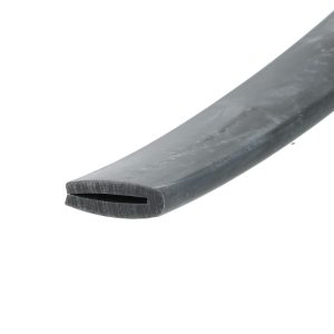 Close-up of a dark gray plastic blade with a rectangular slot, set diagonally against a white background.