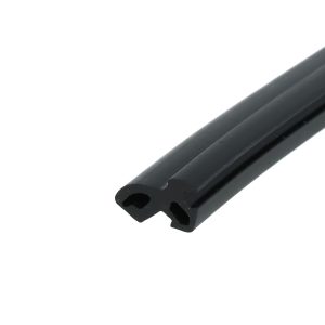 Close-up of a black metal bracket with two rounded holes, photographed diagonally against a white background.