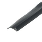 Close-up of a dark, curved edge trim or rail running diagonally across a white background, showing a smooth, glossy surface with a rounded edge at the bottom-left.