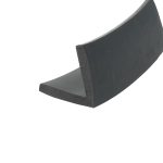Close-up of a black curved foam piece with a rounded edge surface.