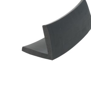 Close-up of a black curved foam piece with a rounded edge surface.