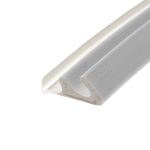 Close-up of a white plastic device with a textured light-gray surface running diagonally across the frame, viewed at an angle.