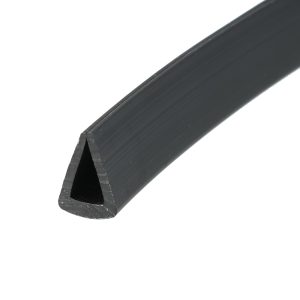 Close-up of a black cylindrical rod with a triangular notch cut at one end.