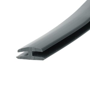 Close-up of a gray metal blade edge with a chipped tip, photographed at an angle against a white background.