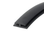 Close-up of a black rubber seal with a U-shaped channel, curved profile over the surface.